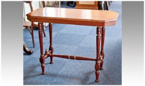 Late Victorian Mahogany Side Table, the top of oblong octagonal form, raised on turned tapering