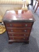 Modern Mahogany Four Drawer Bedside Chest, 25 inches high, 17½ wide and 13 deep.