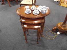 Nest of Three Mahogany Veneered Tables.