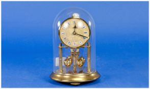 Anniversary 400 Day Brass Mantle Clock, under a perspex dome, with adjustable levelling feet. Good
