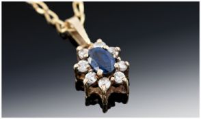 Ladies 9 Carat Diamond and Sapphire Pendant Drop supported on a 9 carat gold chain. 2.5 grammes.