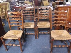 Set of Four Ladder Back Rush Seated Chairs, comprising armchair and three side chairs, the armchair