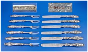 Victorian Silver Set of 12 Ornate Embossed and Engraved Knifes and Forks. The blades and prongs of