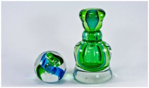 Green Glass Bottle And Stopper Together With A Glass Paperweight