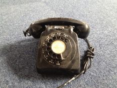 Mid 20th Century Black Bakelite Telephone, with spin dial and an on / off button to top.