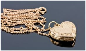 9ct Gold Heart Shaped locket, suspended on a 9ct Gold chain.