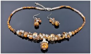 Tiger Eye and Austrian Crystal Necklace and Earrings, the tiger eye pendant drop suspended from a