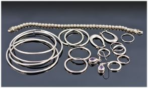 Collection Of Silver Comprising Mostly Earrings And A Tennis Bracelet.