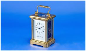 London Clock Co. Brass Carriage Clock. Visible escapement 8 day movement. 5.75 inches high. Good