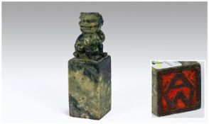 Chinese Green Soapstone Seal surmounted by a foo dog. The initials A.W to base chop. CIrca 1900.