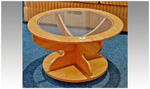 Glass Topped Circular Coffee Table. 16 inches high, 27.5 inches in diameter.
