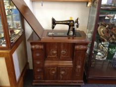 Early 20th Century Mahogany Cased Sewing Machine, the top lifting up to reveal machine, fitted with