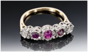 9ct Gold Ruby Ring Set With Three Rubies Between Two Diamonds. Unmarked, Ring Size K