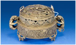 An Unusual Chinese Bronze Circular Censer and Reticulated Cover, with lion handles. The sides with