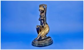 Art Deco Style Reproduction Bronze Figure semi-clad dancer. Raised on an oval shaped stepped marble