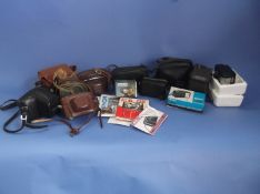 Collection of Assorted Vintage Cameras including Canon, Nikon, Kodak, Halina, Brownie etc