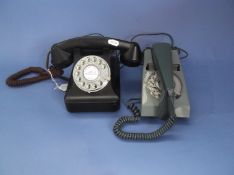 Two Retro Round Dial Telephones. one green and one black Bakelite.