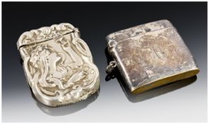 Silver Cased Lighter Together With An Embossed Vesta Case, Both With Dents.