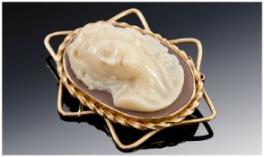 20th Century High Grade Gold Cameo Brooch with raised bust of a young woman, with safety chain. 2.