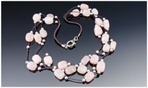 Rose Quartz Triple Strand Necklace, polished, rounded cuboid rose quartz beads hand knotted onto 3