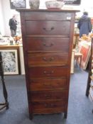 Modern Mahogany Seven Drawer Chest, all drawers with swan neck handles, raised on stile legs, 55