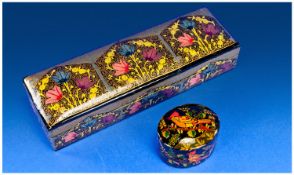 Two Handpainted Papier Mache Black Lacquer Boxes. 1 an oval box with pull-off lid handpainted in