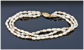 Three Strand Fresh Water Pearl Bracelet, Set With A 14ct Gold Clasp And Bauble Spacers.