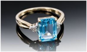 9ct Gold Dress Ring, Central Set Blue Aquamarine Coloured Stone Between Diamond Set Shoulders,