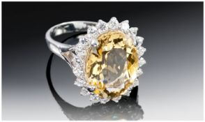 Sterling Silver Dress Ring, Set With A Large Oval Cut Citrine, Surrounded By White Sapphires.