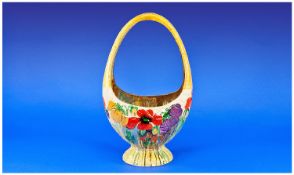 Large Clarice Cliff Ovoid Basket, brightly painted Pansy pattern to the cream glazed `wickerwork`