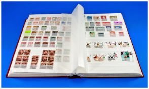 Large Hingeless Stamp Album Containing a Large Collection of World Stamps. Mostly used but with a
