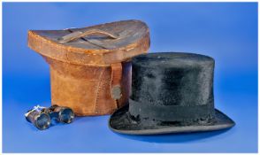 Top Hat in Leather Hat Box, black silk top hat with wool band by Dunn & Co., London, shaped hat box