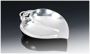 Tiffany and Co. A Very Stylish Leaf Shaped Sterling Silver Dish supported on a ball foot and with a