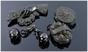 Collection Of Jet Jewellery Comprising two Brooches, a Locket and one other item possibly
