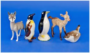 Four Various Figures, comprising penguin, two Beswick figures, a small Russian bird figure and a