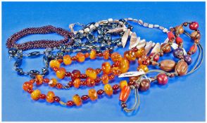 Mixed Lot Of Costume Jewellery, Including An Amber Coloured Bead Necklace.