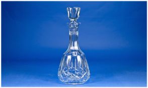 A Fine Quality Cut Crystal Decanter with star cut base, and faceted sides. 11.5`` in height.