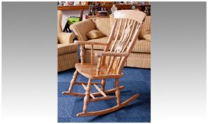 Modern Solid Beech Rocking Chair, with large crest rail, shaped and pierced back splat, saddle