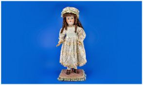 Large German Bisque Head Doll, open mouth with teeth, fixed brown eyes, painted lower lashes,