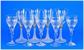 Set of Five Cut Glass Champagne Glasses, together with a set of four contemporary wine glasses,