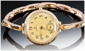 Omega 9ct Gold Ladies 1920`s Manual Wind Wristwatch, with ornate gold dial and fingers. Hallmark