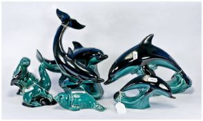 Poole Collection of Six Figures and Figure Groups, comprising two figures of Dolphins, one figure