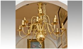 Large Contemporary 12 Branch Brass Chandelier, with eight main branches and four upper branches,