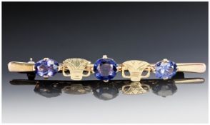 Egyptian High Carat Gold Bar Brooch, Set With Three Oval Faceted Stones Changing Colours From Blues