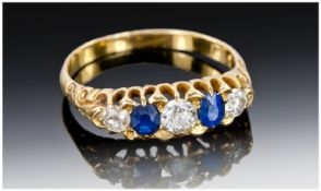 18ct Diamond And Sapphire Ring Three Round Cut Diamonds Set Between Two Sapphires In A Gallery