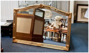 Modern Gilt Framed Mirror, arched top, moulded frame with baroque style decoration, measuring 35