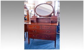 Edwardian Mahogany Dressing Table, with oval mirrored back, two small drawers over two long