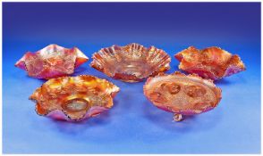 Group of Five Orange Carnival Glass Dishes, all with embossed foliage decoration and wavy edged