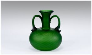 Green Glass Two Handled Vase in the shape of an Ancient Roman flask or aryballos with wide, low