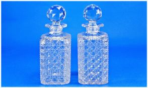Pair of Cut Glass Decanters, mid 20th century, of square form, with multifaceted stoppers, faceted